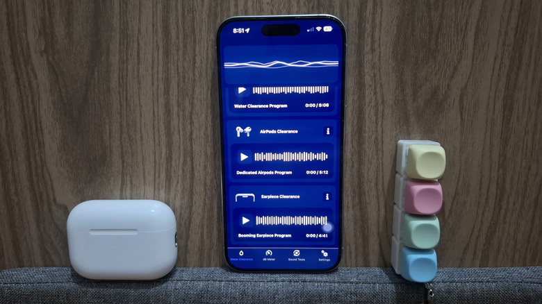 AirPods next to iPhone showing WaterDrop app