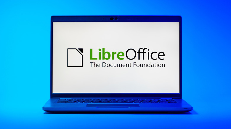 LibreOffice displayed on a laptop screen over a blue background