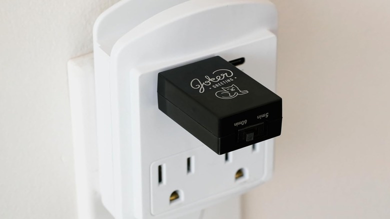 Joker Greeting USB Cat Meow Prank plugged into wall outlet