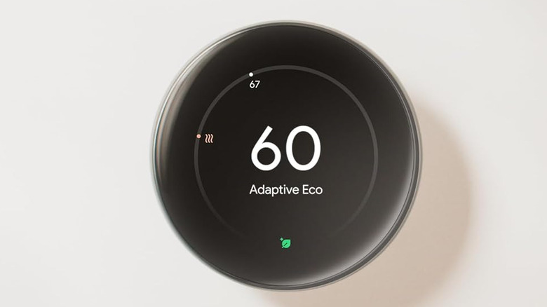Google Nest Learning Thermostat 4th Gen showing 60 degrees on a wall.
