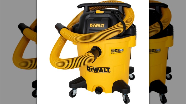 A DeWalt wet/dry vac with its hose wrapped up.