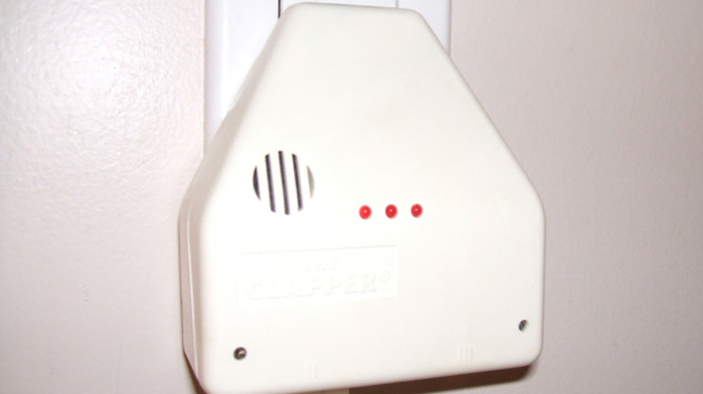 The Clapper switch mounted in an electrical outlet