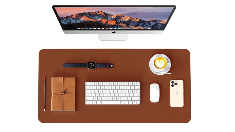 WAYBER leather desk pad protector from the top down with items organized on top.