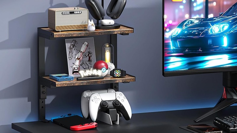 Two Tier OUTIOE shelf with clamps for desktop in a game room.