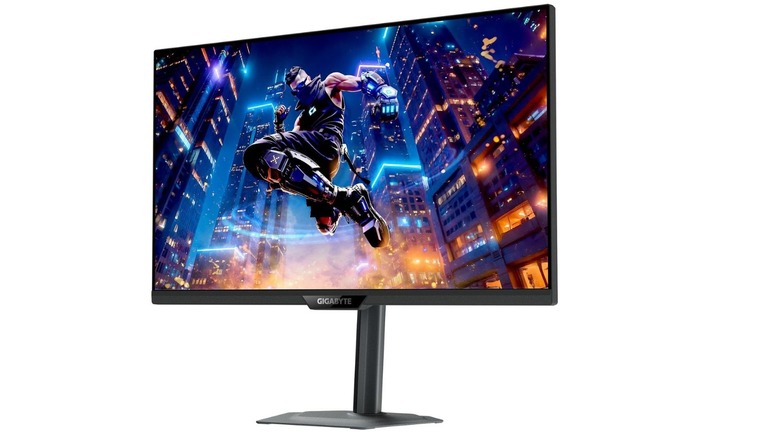 Gigabyte M27UP gaming monitor showing a colorful action game scene on a white background.