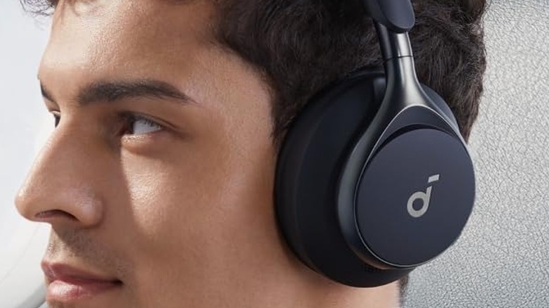A man wearing the Anker Space One ANC Headphones.