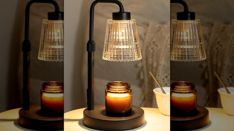 A Godonlif Candle Warmer Lamp with a candle under it.
