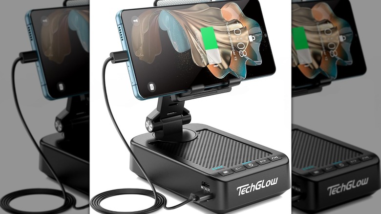 A smartphone plugged into a TechGlow Foldable Cellphone Stand.