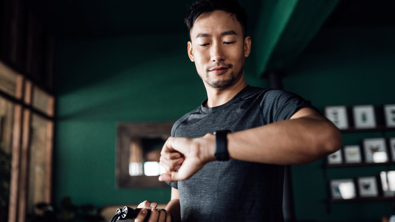Galaxy watch user exercising at home