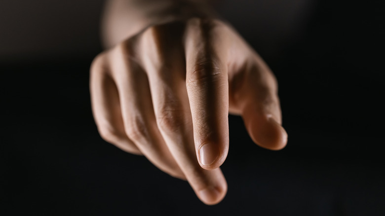 A hand attempting to perform a gesture on Galaxy Watch