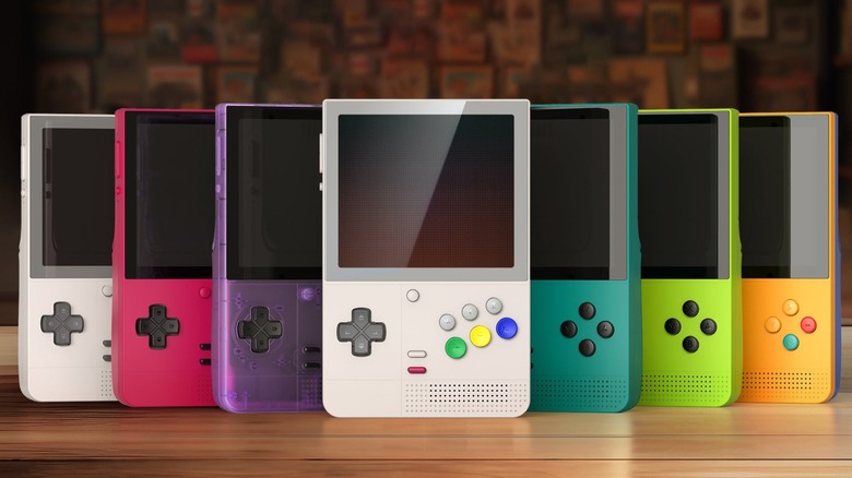 Lineup of Retroid Pocket Classic Handheld consoles on a wooden table