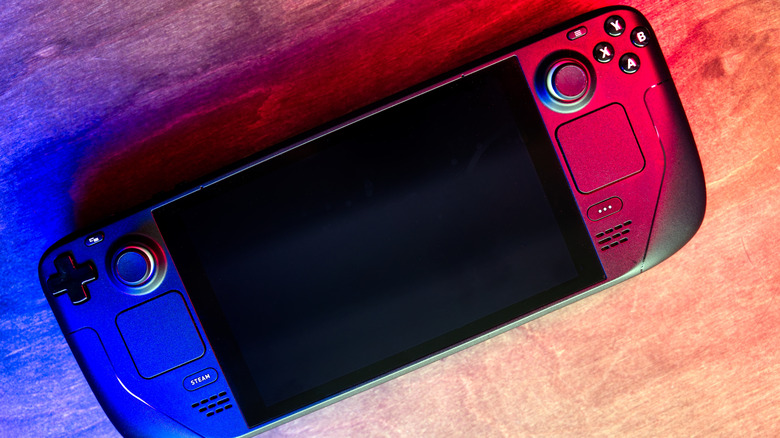 Steam Deck handheld console on a wooden table