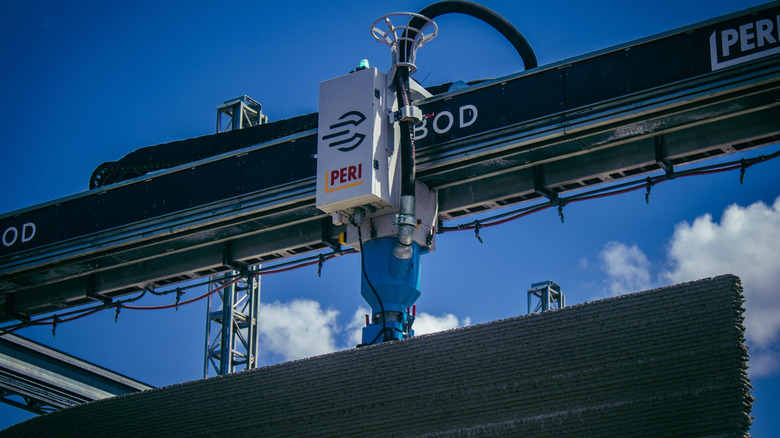 Concrete 3D printer building an apartment complex in France.