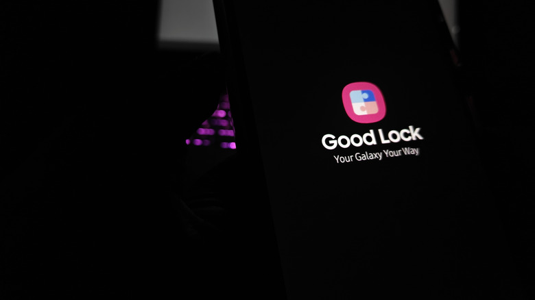 A phone displaying Good Lock with logo in dark light