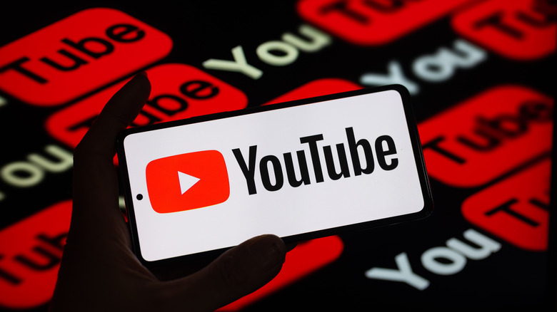YouTube logo on a smartphone screen