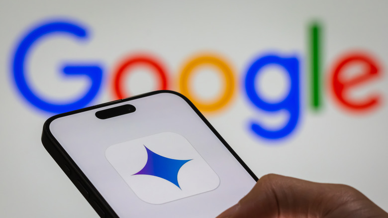 Gemini symbol on a smartphone with the Google logo in the background