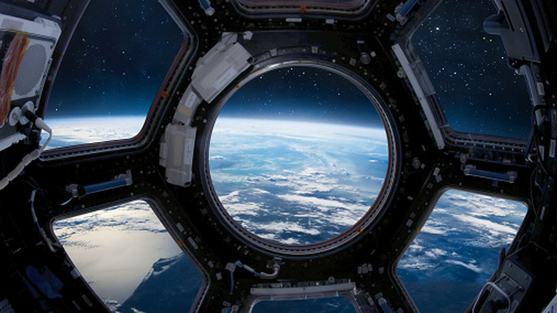 The view of Earth through a porthole on the ISS.