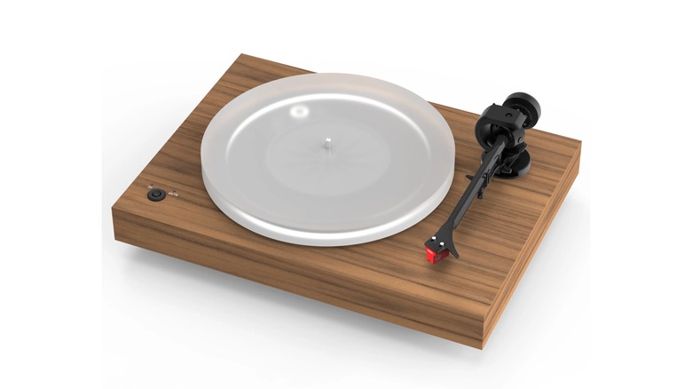 The Pro-Ject X2 B record player sitting on a white surface