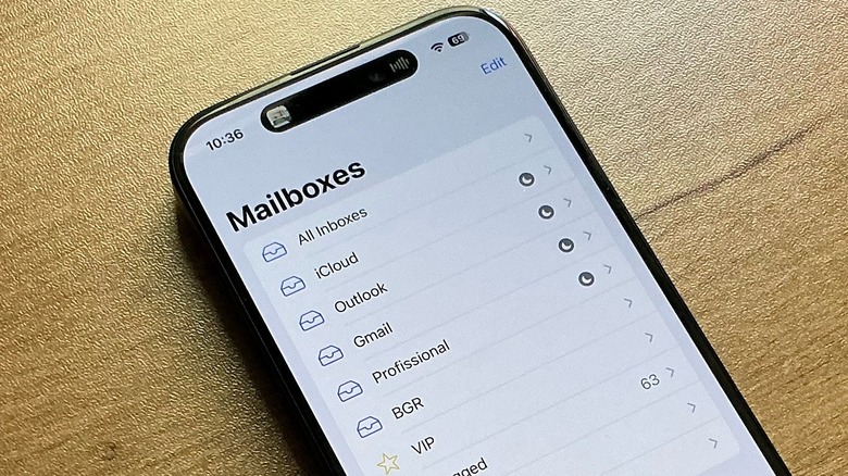 Up-close shot of an iPhone on a table with the Mail app opened