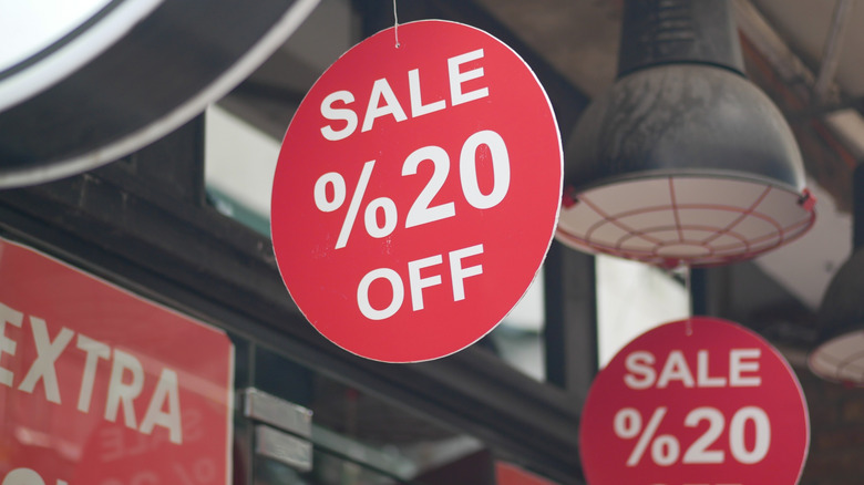 discount sign reading 20% off at a store
