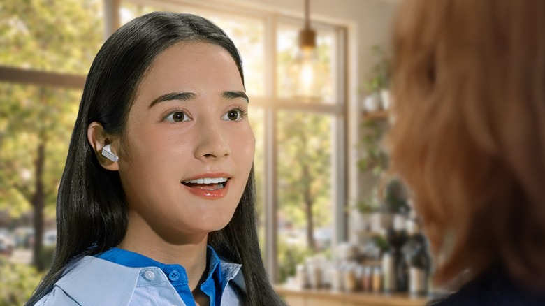 Person wearing Samsung Galaxy Buds 4 Pro while having a conversation