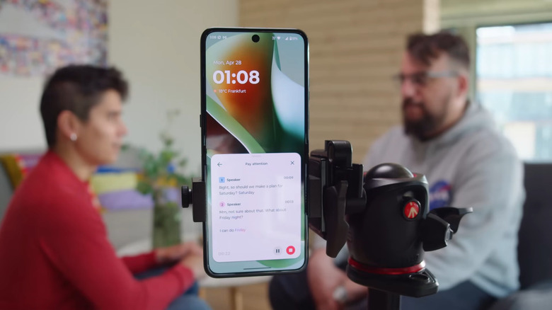 Motorola on tripod with Pay Attention feature listening to two people in the background