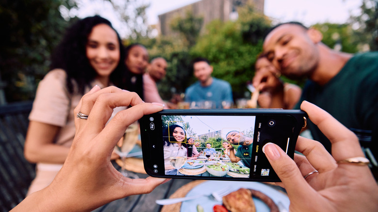 Taking a picture of friends with an iPhone