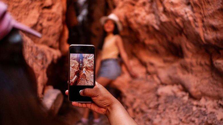 Taking a picture with an iPhone photo in a rocky environment