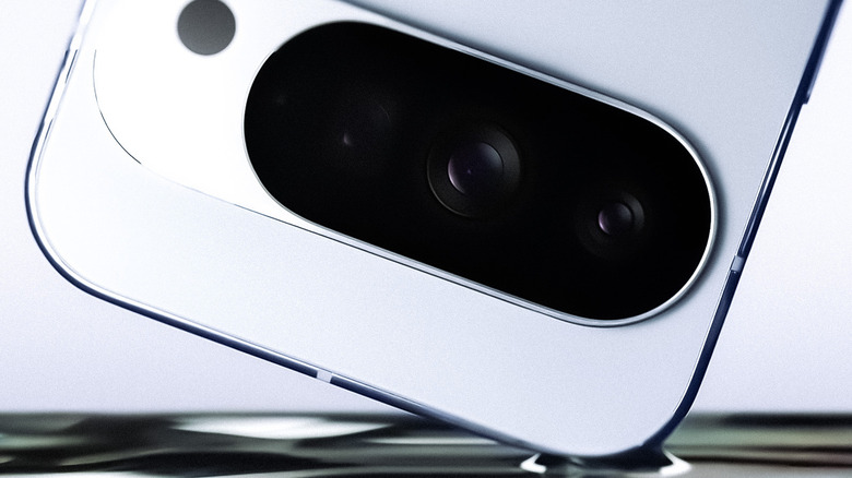 Google Pixel 10 camera array on a liquid metal and grey background