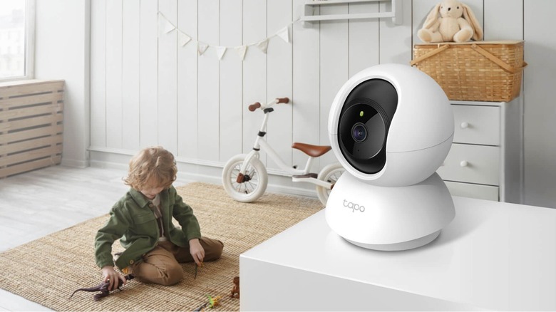 Tapo C210 2K Pan Tilt Security Camera on counter focused on child on the floor