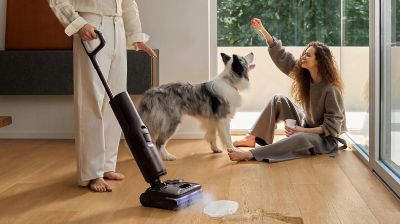 A man cleaning his home with Roborock's F25 Ultra Steam Gen 2