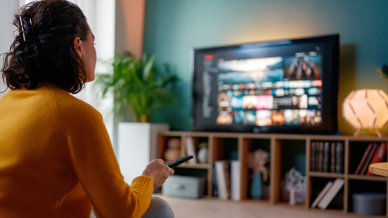 person relaxing at home in living room