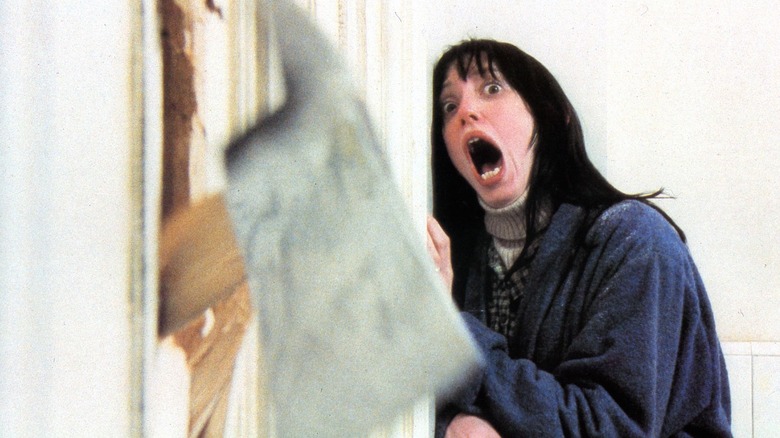 Shelley Duvall as Wendy Torrance hiding from an axe in The Shining