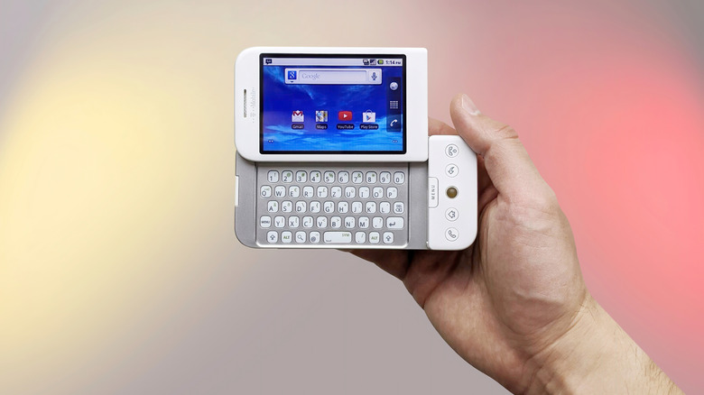 The T-Mobile G1, also known as the HTC Dream, in a person's hand.