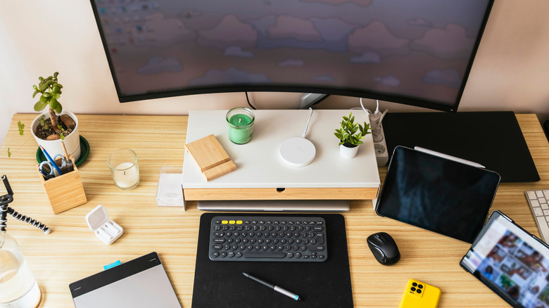 A computer desk setup with IKEA Elloven Monitor Stand with Drawer