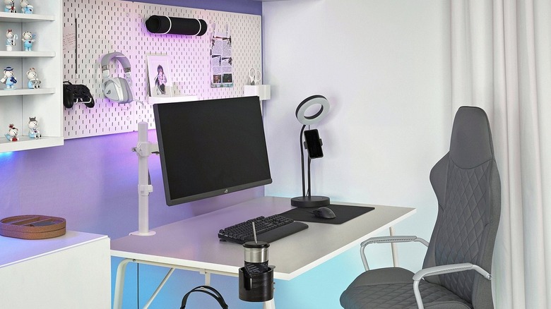 The Stubberget Bracket for Monitor mouted to the back of a computer desk