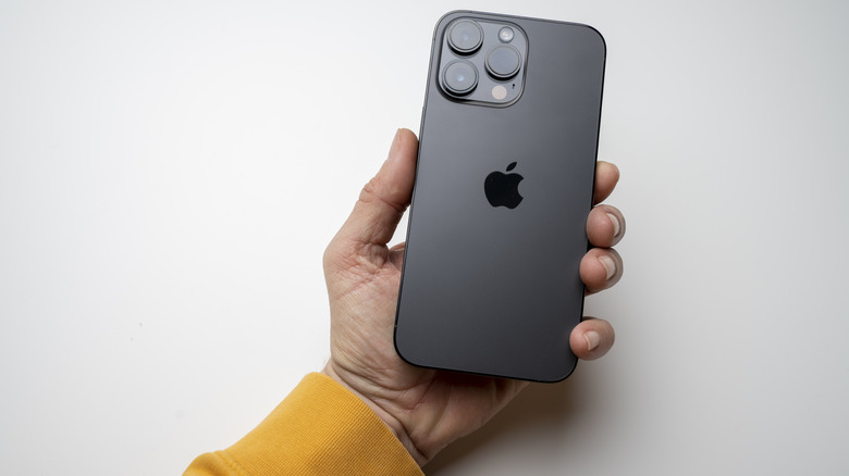 A person holding up an iPhone