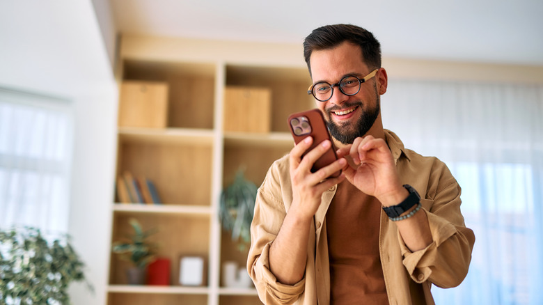 A man using an iPhone