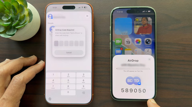 Two iPhones showing AirDrop codes on iOS 26