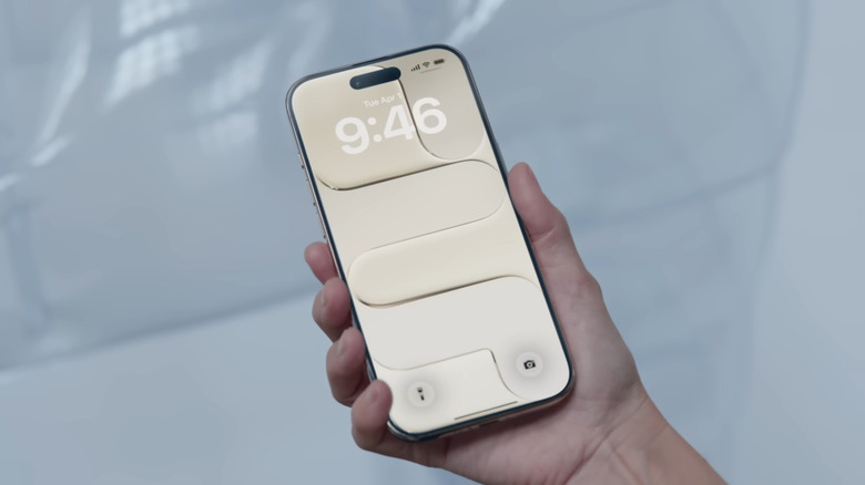 Hand holding iPhone Air