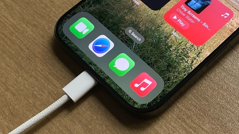 iPhone charging via USB-C on a table
