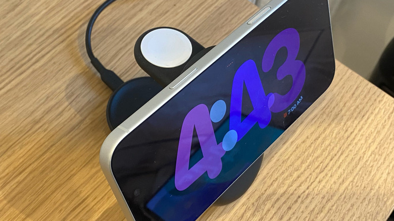 iPhone charging on a Belkin stand
