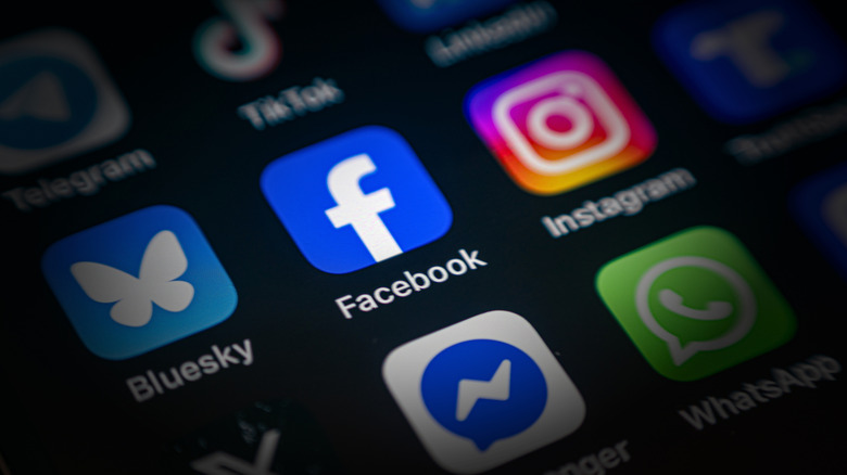 Facebook App icon among various application icons on smartphone screen