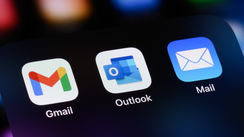 Popular email apps on a smartphone: Gmail, Microsoft Outlook, and Apple Mail.