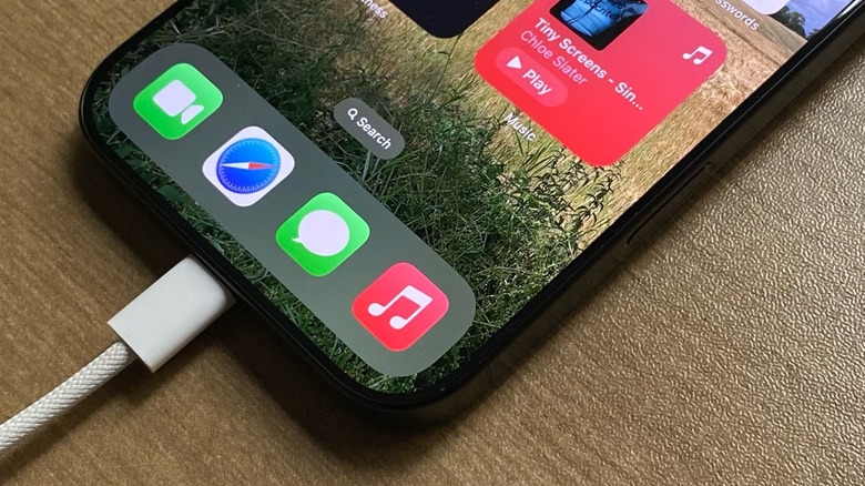 An iPhone on a table charging through USB-C