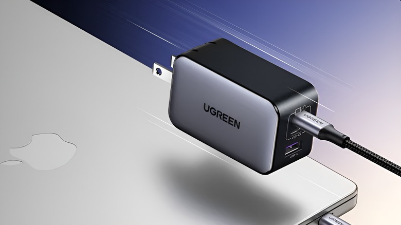The Ugreen Nexode charger on top of a MacBook