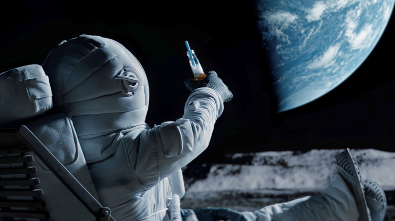 Astronaut having a beer on the moon
