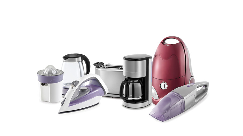 Multiple small household appliances on a white background