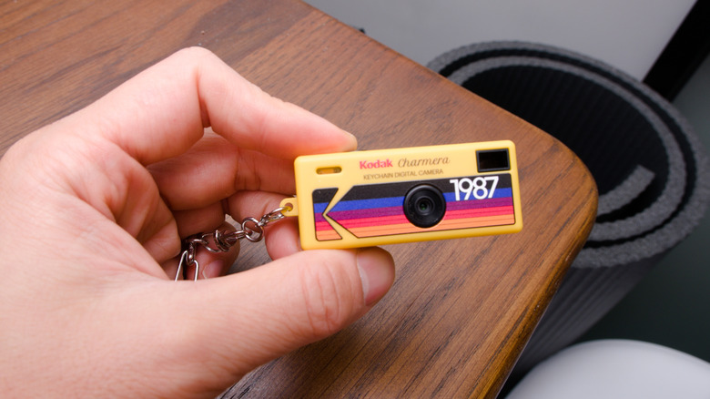 A hand holding a Kodak Charmera keychain camera