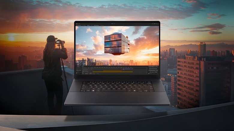 Asus ProArt P16 on a sunset rooftop background with a photographer taking the image that is on-screen of an abstract cube.